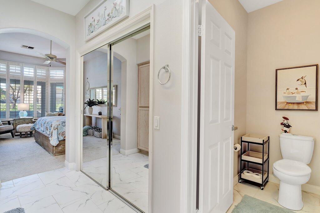 38635 Orangecrest Road Palm Desert, CA 92211 - Photo 15 of 34 a spacious bathroom with a toilet and a shower