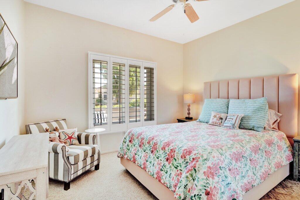 38635 Orangecrest Road Palm Desert, CA 92211 - Photo 17 of 34 a bedroom with a bed and a couch