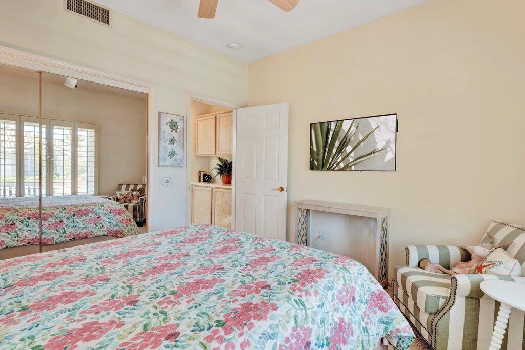 38635 Orangecrest Road Palm Desert, CA 92211 - Photo 18 of 34 a bedroom with a bed and a dresser