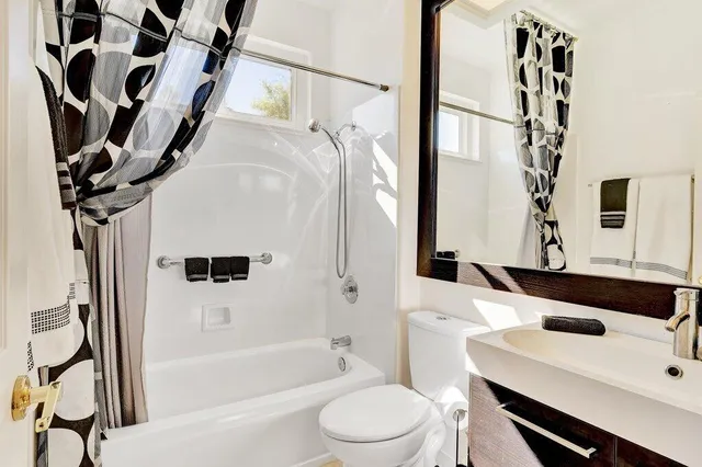 a bathroom with a sink a toilet and a bathtub