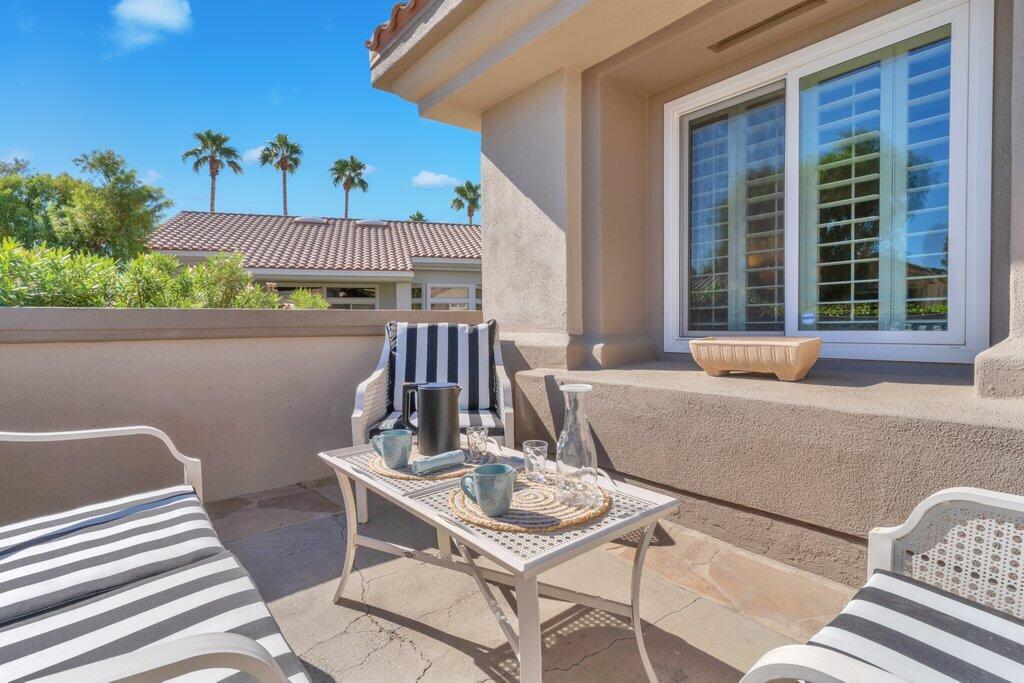38635 Orangecrest Road Palm Desert, CA 92211 - Photo 22 of 34 a view of a patio with table and chairs