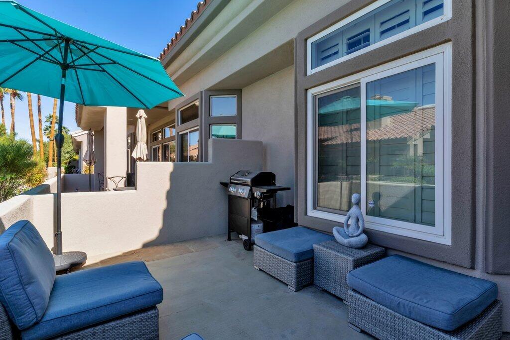 38635 Orangecrest Road Palm Desert, CA 92211 - Photo 26 of 34 a living room with furniture and a window