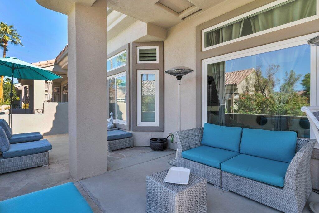38635 Orangecrest Road Palm Desert, CA 92211 - Photo 27 of 34 a living room with furniture and a large window