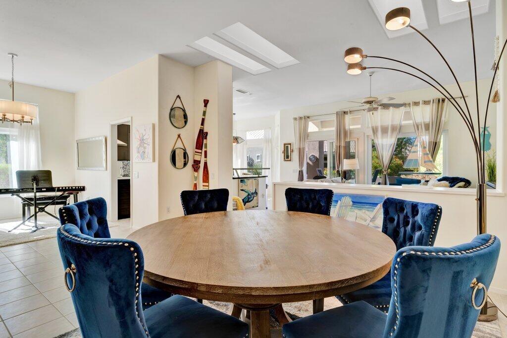 38635 Orangecrest Road Palm Desert, CA 92211 - Photo 3 of 34 a view of a dining room with furniture and wooden floor