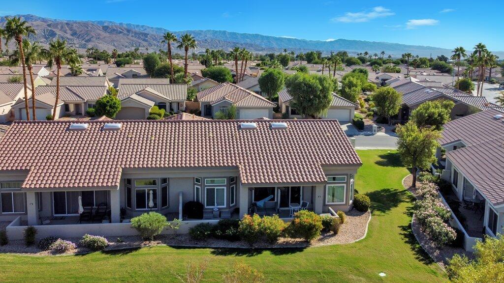 38635 Orangecrest Road Palm Desert, CA 92211 - Photo 31 of 34 a front view of a house with a yard and outdoor seating