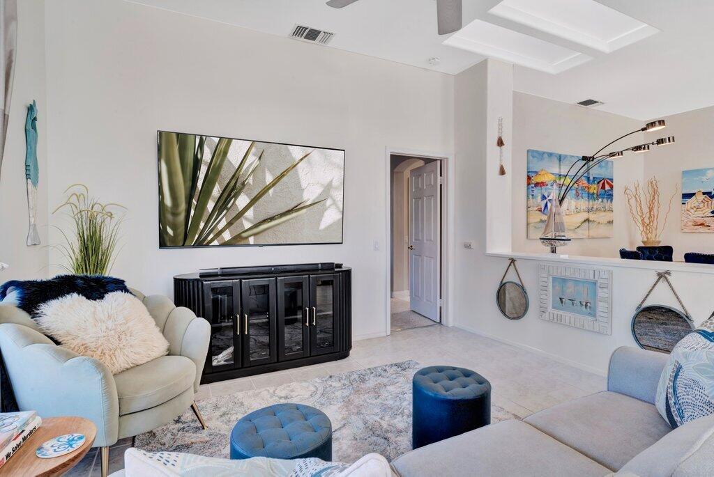 38635 Orangecrest Road Palm Desert, CA 92211 - Photo 4 of 34 a living room with furniture a rug and a window
