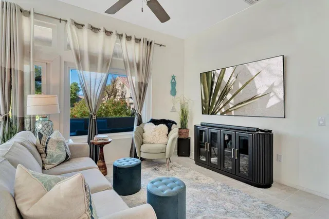 a living room with furniture and a large window