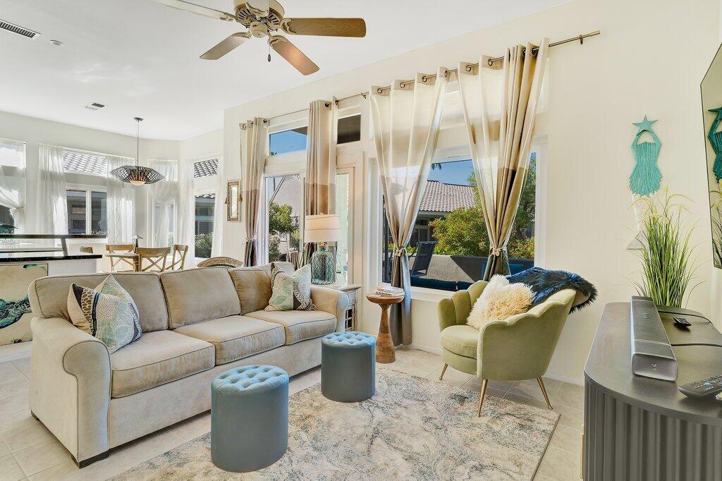 38635 Orangecrest Road Palm Desert, CA 92211 - Photo 6 of 34 a living room with furniture and a large window