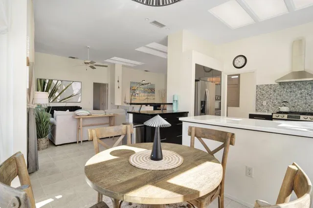 a dining room with furniture and wooden floor