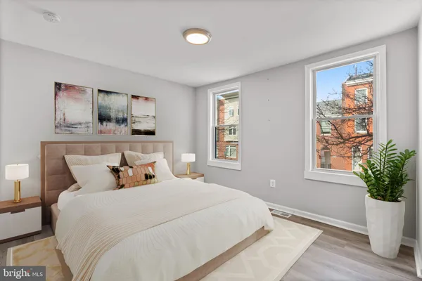 a bedroom with bed and window