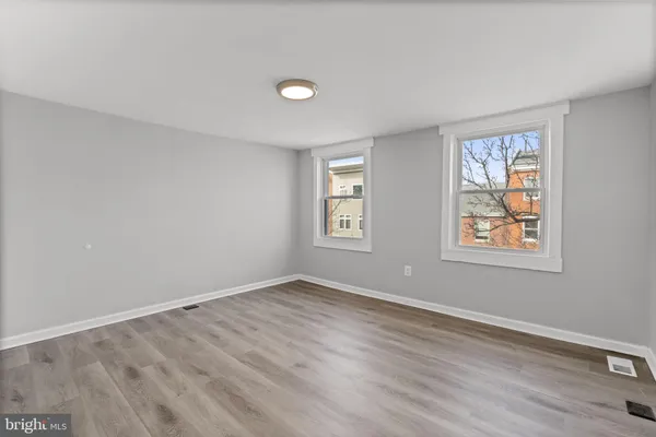 a view of room with window and hardwood floor