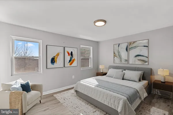 a bedroom with a bed and a couch