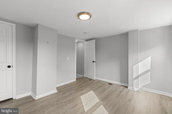 a view of entryway with wooden floor