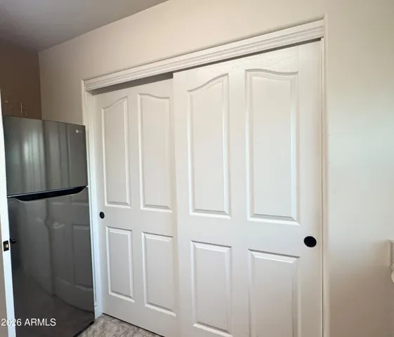 a view of a refrigerator in kitchen
