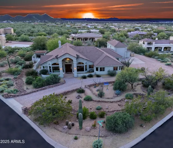 an aerial view of a house with mountain view