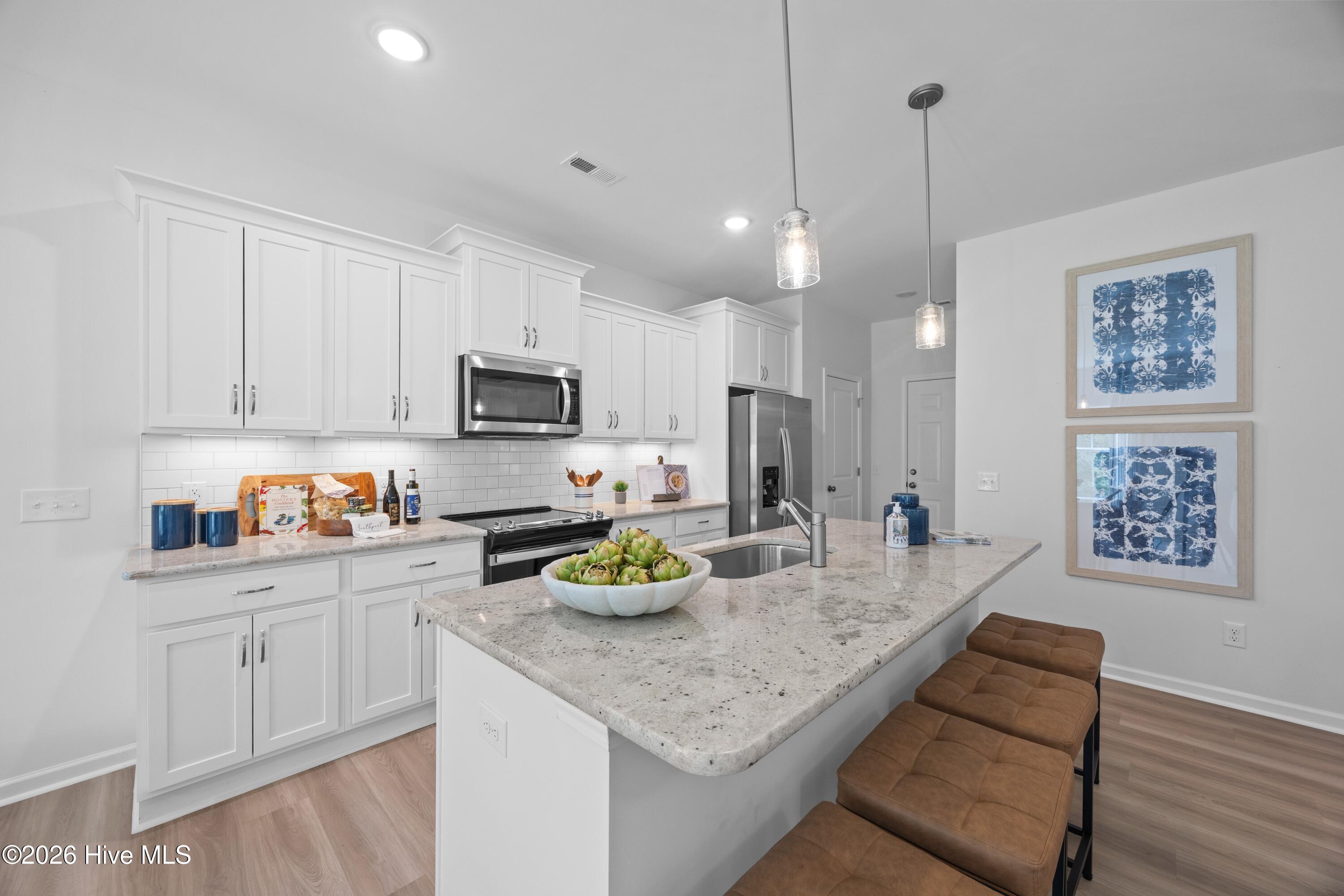 407 Loggerhead Boulevard Hampstead, NC 28443 - Photo 6 of 19 Pebble Kitchen (2)
