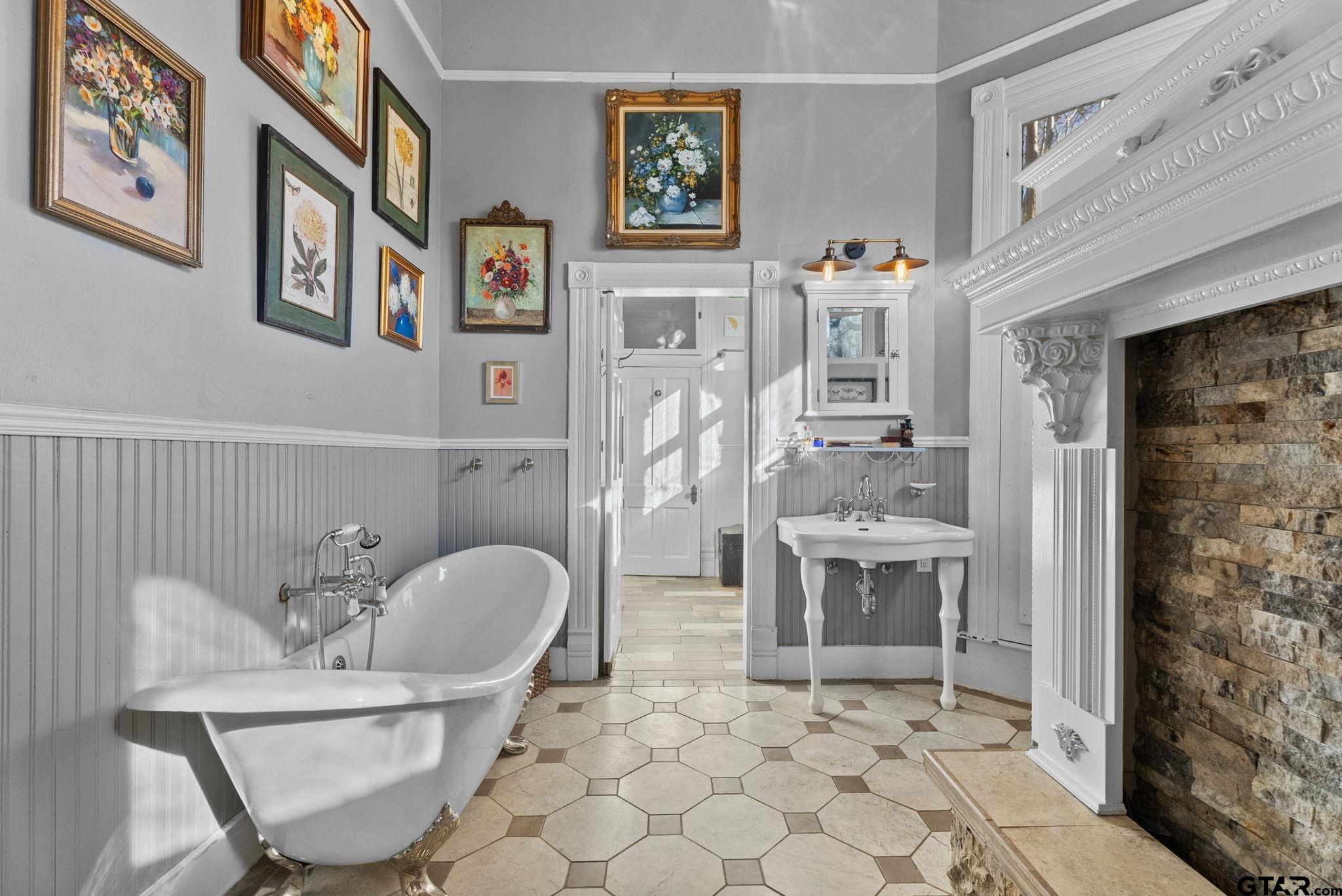 911 West Houston Street Tyler, TX 75702 - Photo 23 of 48 a living room with furniture and a fireplace