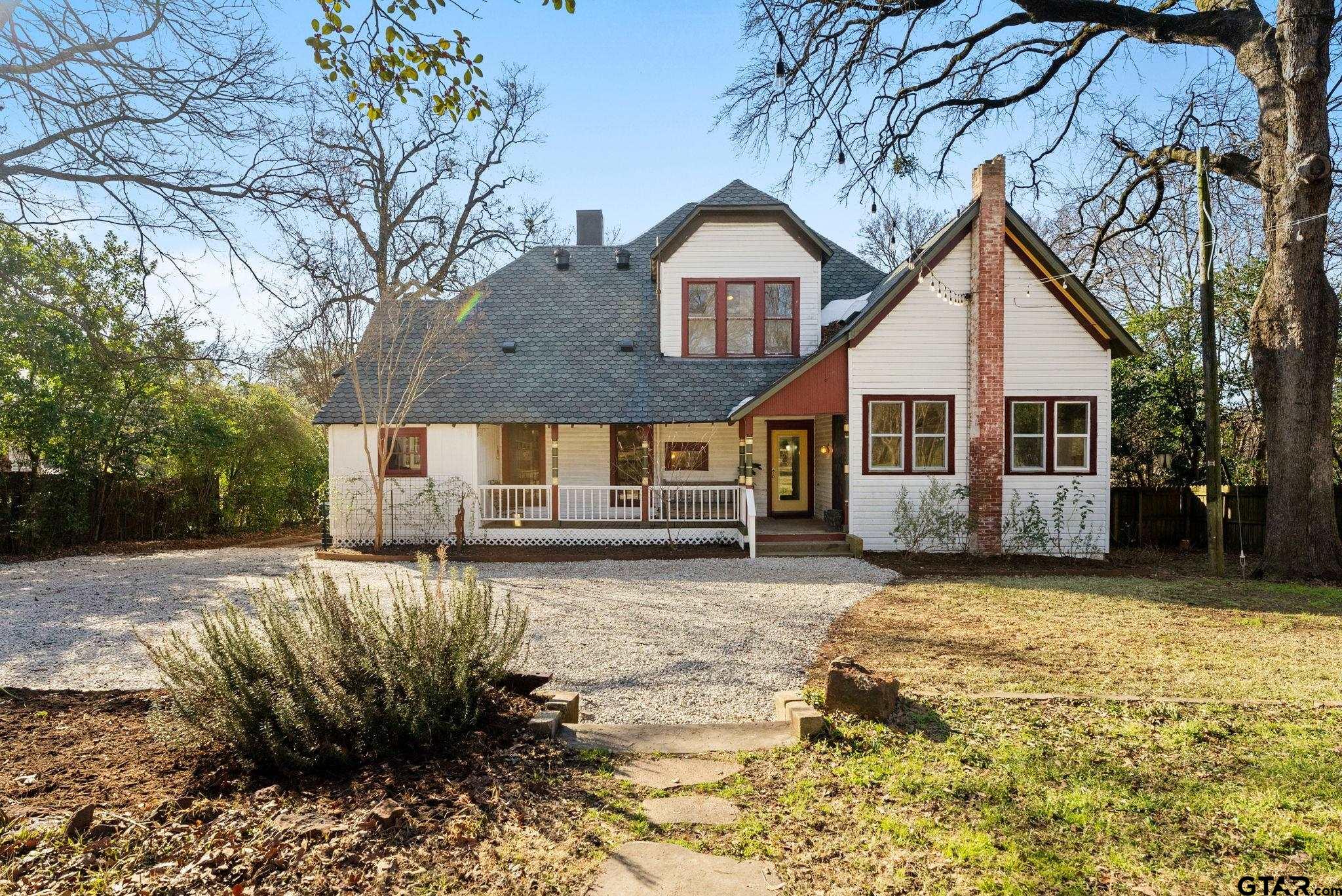 911 West Houston Street Tyler, TX 75702 - Photo 37 of 48 a view of a house with a yard covered in snow