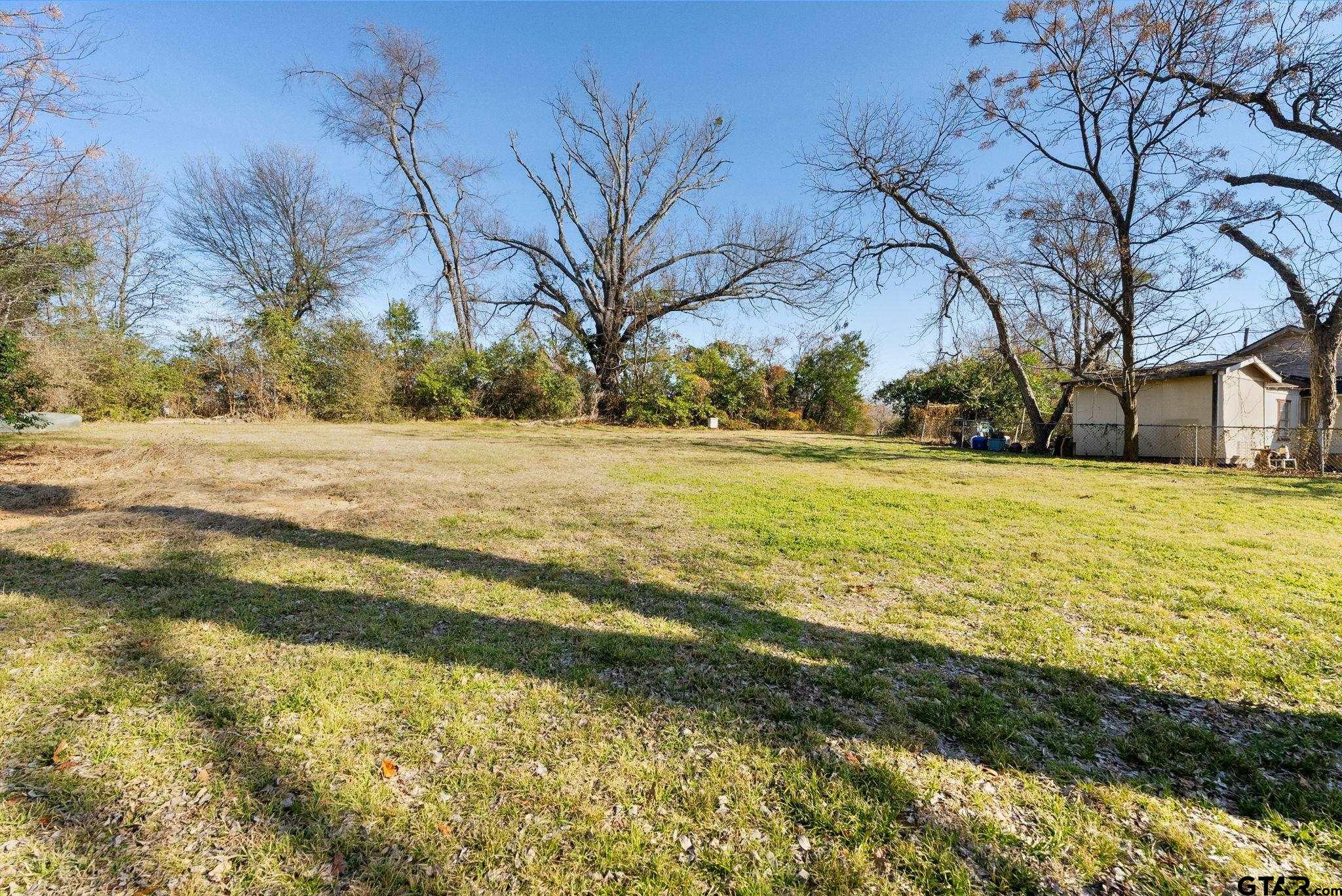 911 West Houston Street Tyler, TX 75702 - Photo 45 of 48 a view of a yard with a house