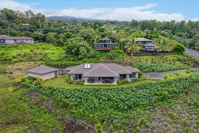an aerial view of multiple houses with yard