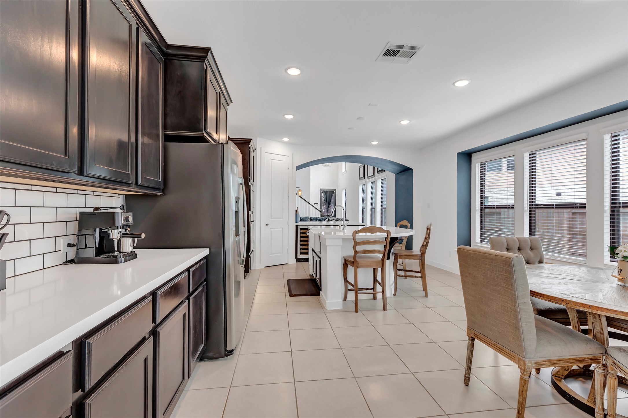 527 Chestnut Reef Court Conroe, TX 77304 - Photo 18 of 40 a kitchen with stainless steel appliances granite countertop a sink a stove and a refrigerator