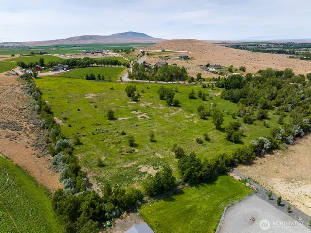 a view of a lake with houses in the back