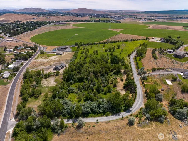 an aerial view of a golf course with a garden