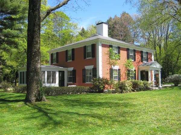 335 Boston Post Road Weston, MA 02493 - Photo 1 of 18 a front view of a house with garden