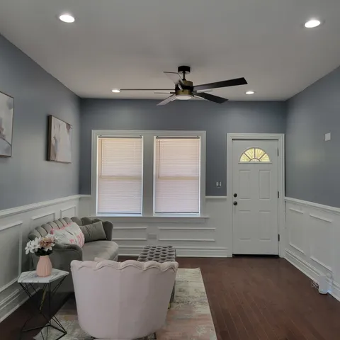 a living room with furniture and window