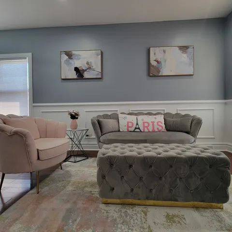 a bedroom with a bed and couch