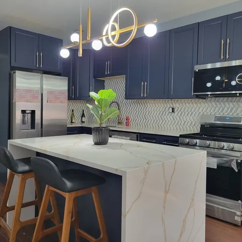 a kitchen with a table chairs and a stove