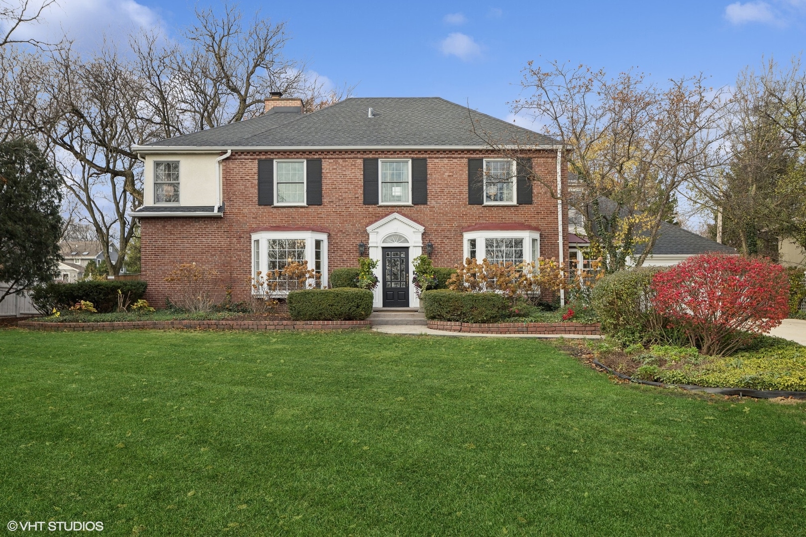 906 Harding Road Hinsdale, IL 60521 - Photo 1 of 31 a front view of a house with a garden