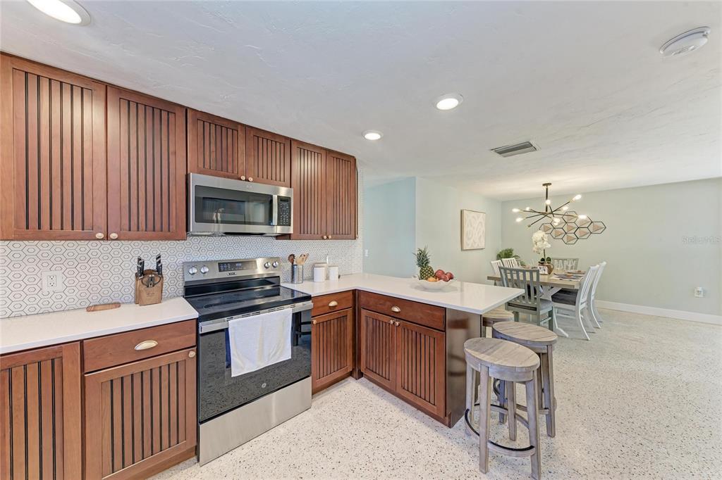 730 Fox Street Longboat Key, FL 34228 - Photo 17 of 40 a kitchen with a sink stainless steel appliances and cabinets