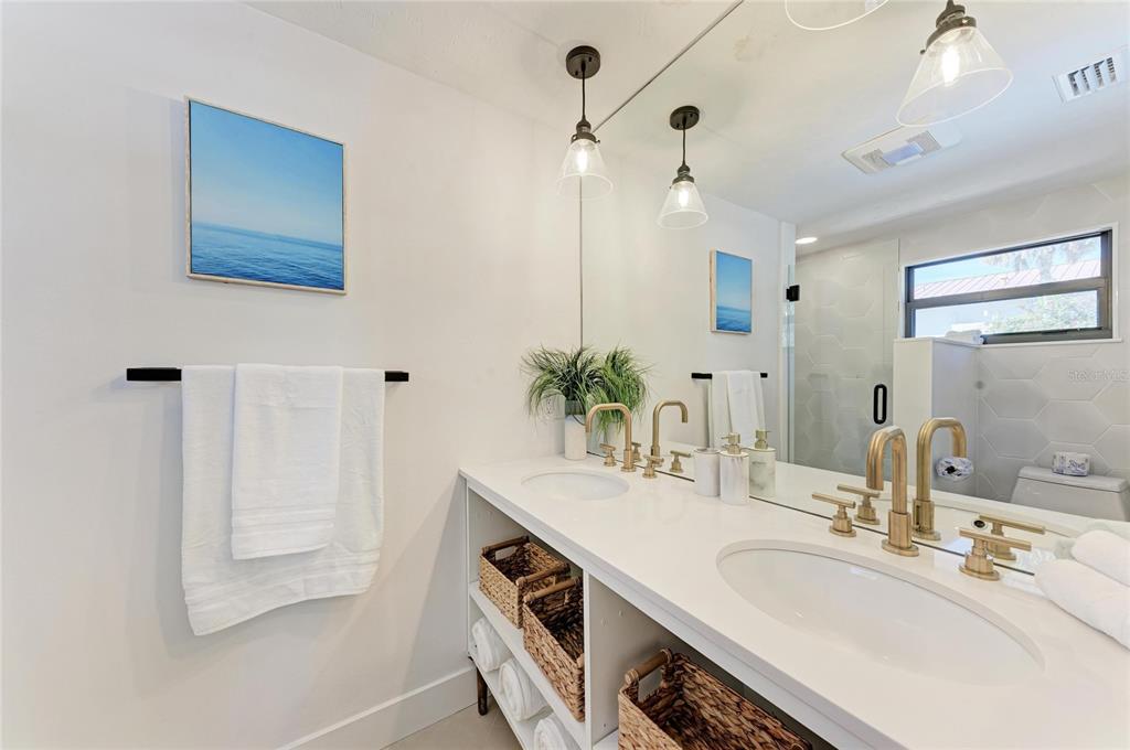 730 Fox Street Longboat Key, FL 34228 - Photo 22 of 40 a bathroom with a sink and a mirror