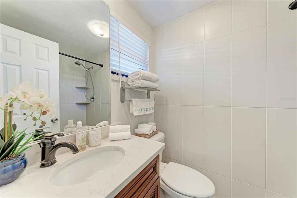 730 Fox Street Longboat Key, FL 34228 - Photo 24 of 40 a bathroom with a sink a toilet and shower