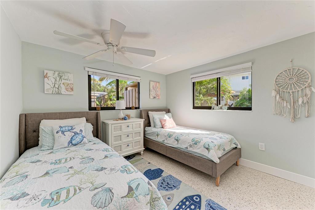 730 Fox Street Longboat Key, FL 34228 - Photo 30 of 40 a bedroom with two beds and a window