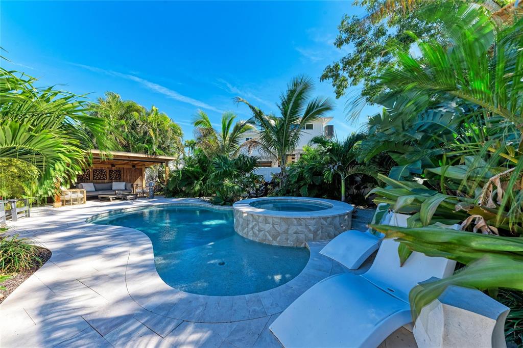 730 Fox Street Longboat Key, FL 34228 - Photo 3 of 40 a view of a swimming pool with a patio