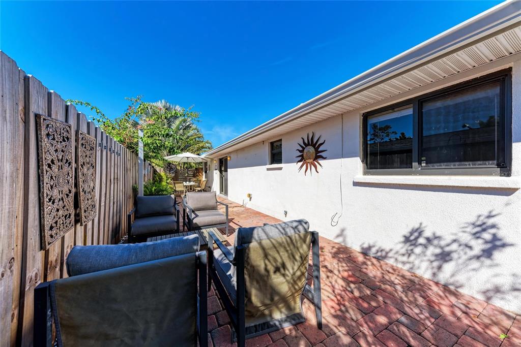 730 Fox Street Longboat Key, FL 34228 - Photo 36 of 40 a view of a patio with chair and tables
