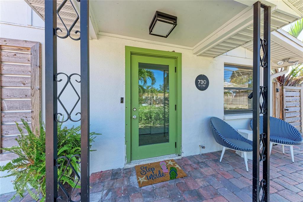 730 Fox Street Longboat Key, FL 34228 - Photo 8 of 40 a front view of a house with garden