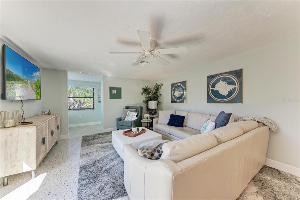 730 Fox Street Longboat Key, FL 34228 - Photo 10 of 40 a living room with furniture and a flat screen tv
