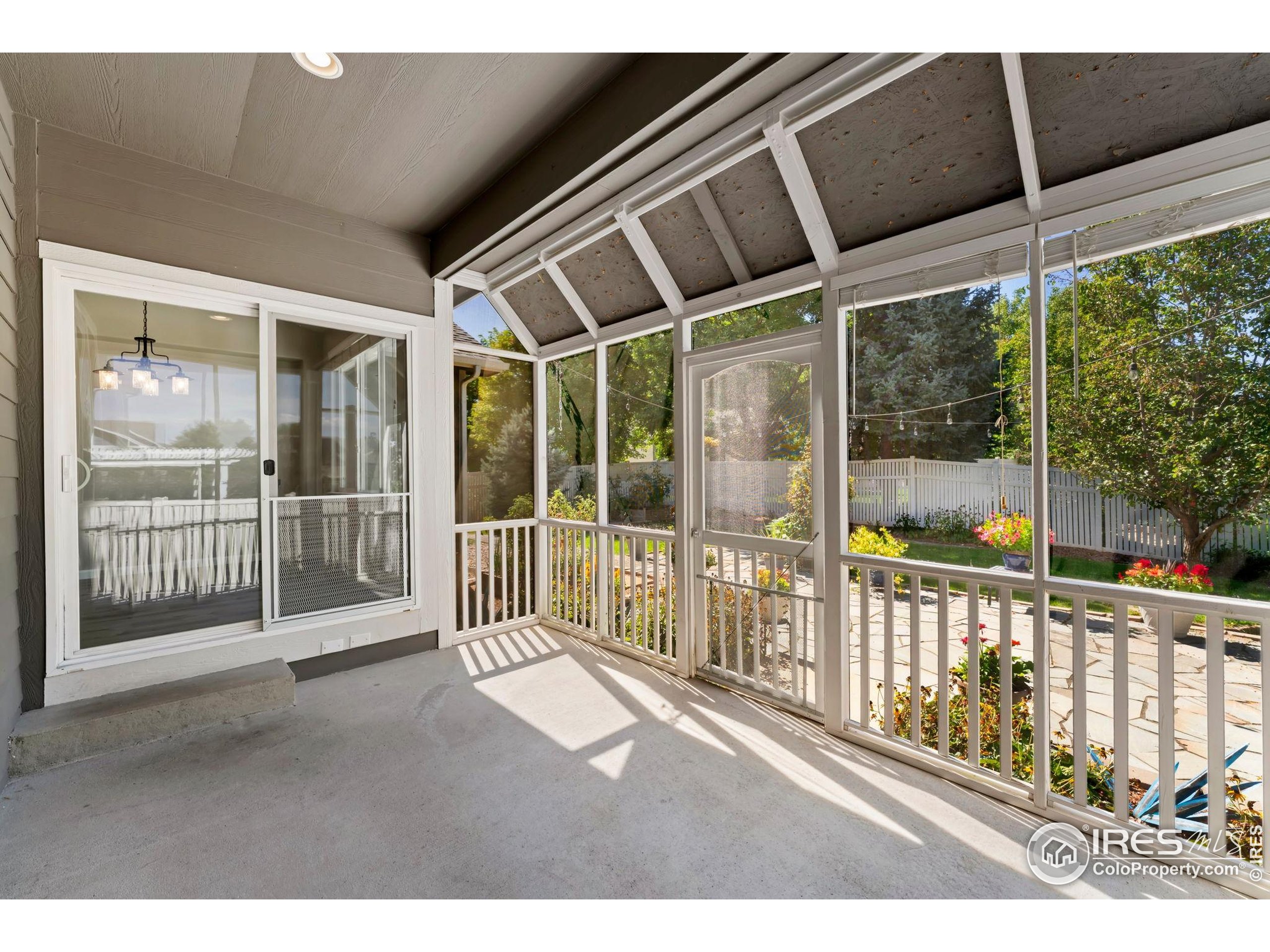 11449 Coal Ridge Street Firestone, CO 80504 - Photo 15 of 33 a view of a porch with wooden floor and outdoor space