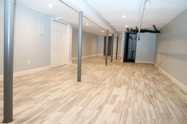 a view of a room with a wooden floor