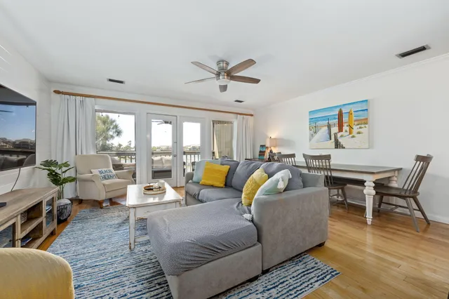 a kitchen with stainless steel appliances granite countertop a sink a stove a microwave cabinets and a refrigerator