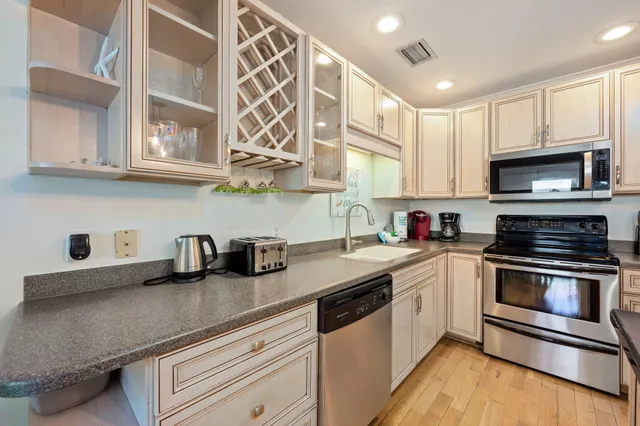 a bathroom with a sink mirror and toilet