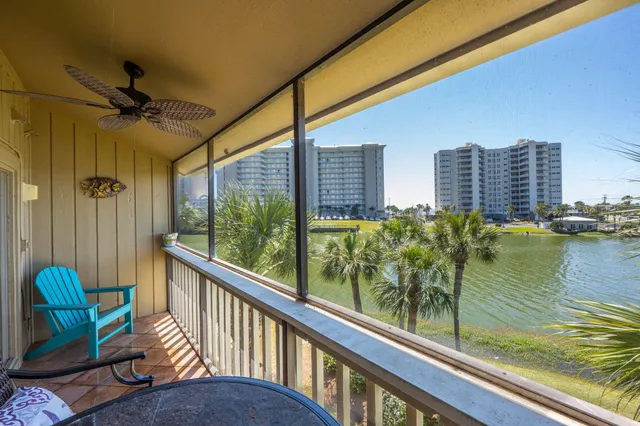 a kitchen with stainless steel appliances granite countertop a sink stove and wooden floor