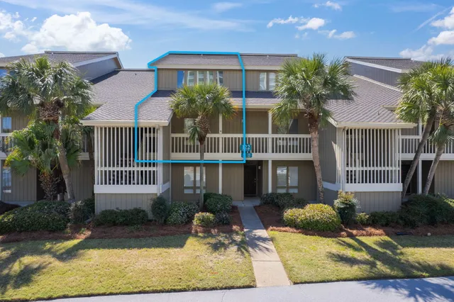 a kitchen with stainless steel appliances kitchen island granite countertop a sink a stove a refrigerator cabinets and chairs