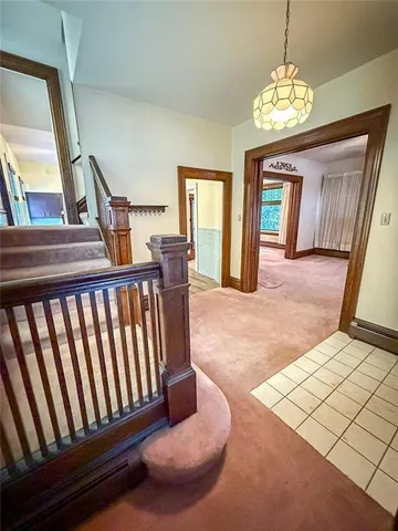 a view of a couches and a chandelier in a room