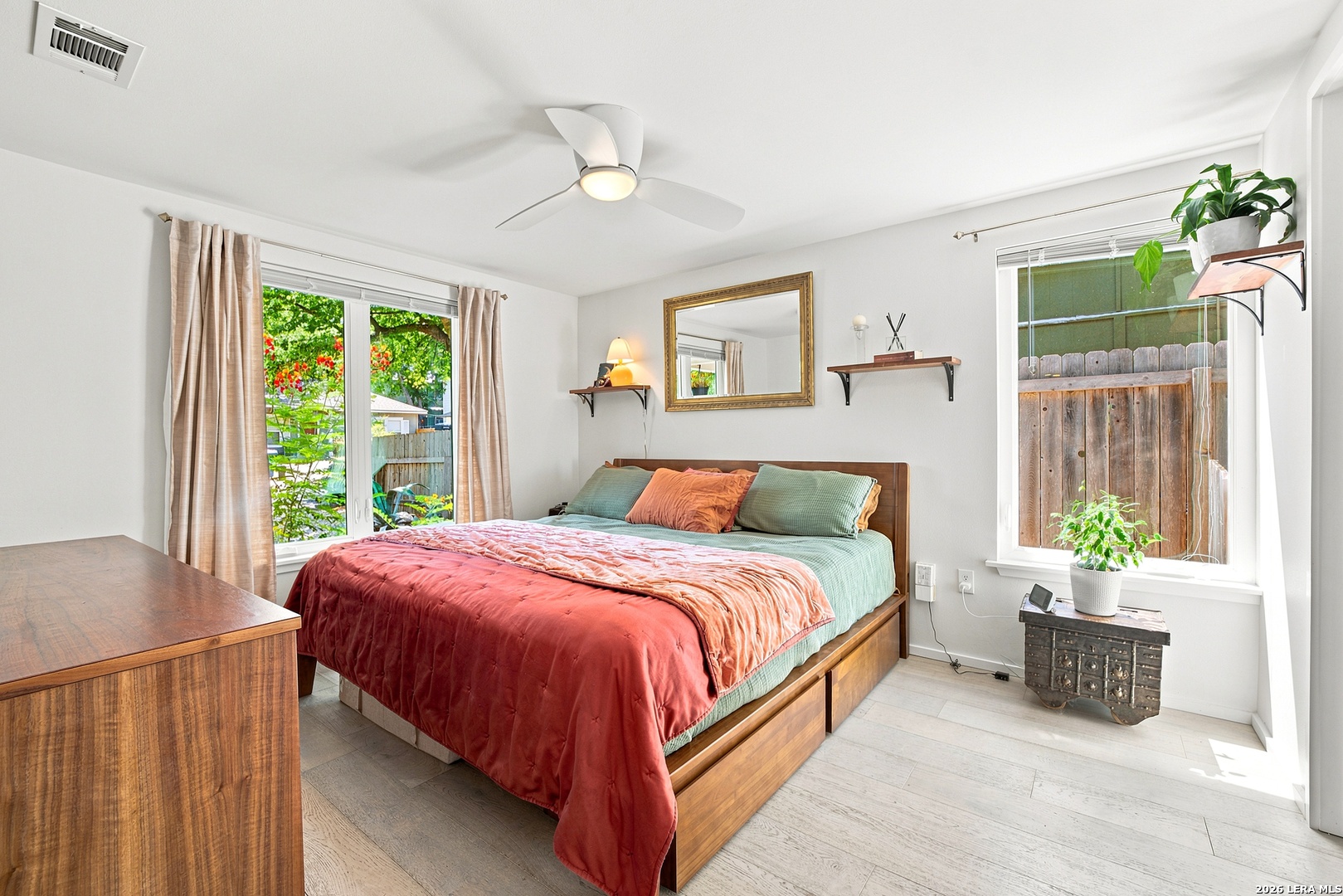 4610 Tanney Street Austin, TX 78721 - Photo 13 of 27 a bed sitting in a bedroom next to a window