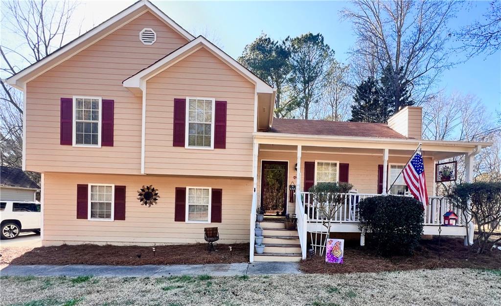 884 Poole Bridge Road Hiram, GA 30141 - Photo 1 of 1 a front view of a house with a yard