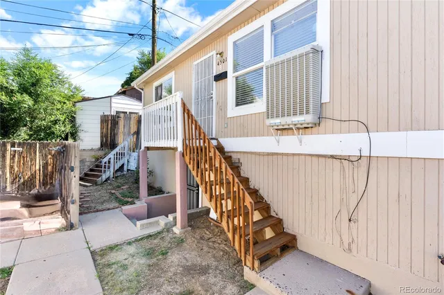 a view of balcony with wooden floor and outdoor seating